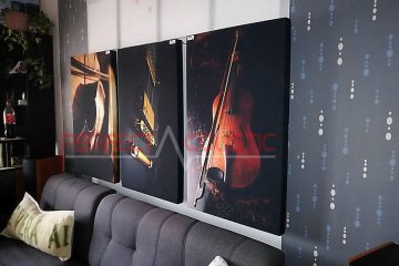 a printed acoustic panel placed on the wall in the cinema room